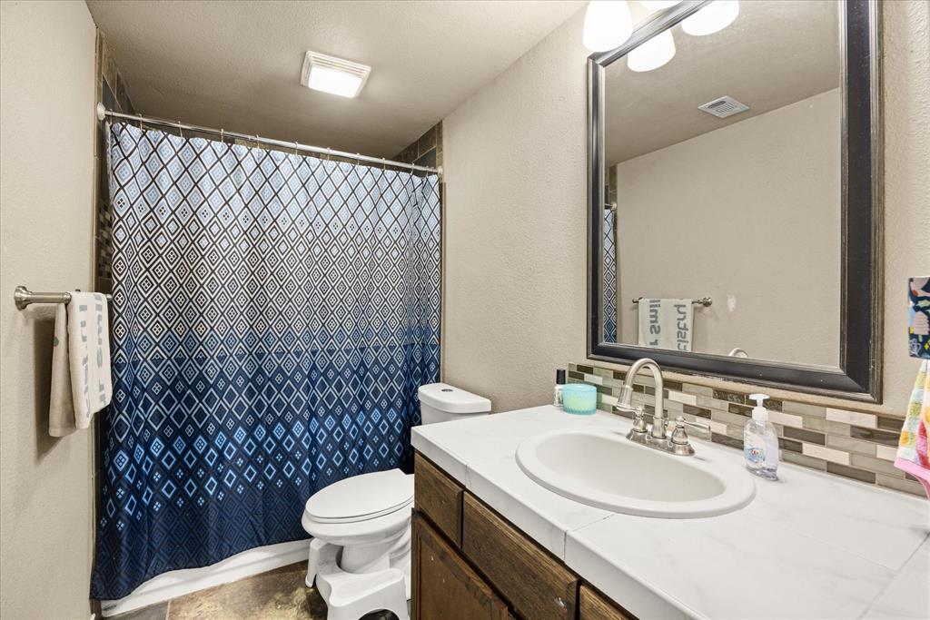 Main level bathroom for guests and serves on bedroom.