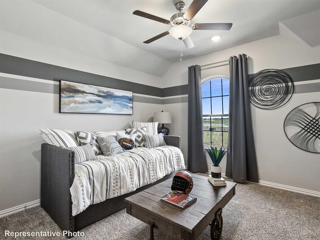 Vaulted ceiling with a flush-mount light fixture and ceiling fan