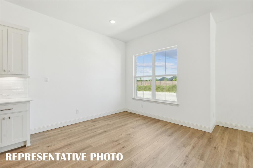 This dining area features oversized windows and space for a table large enough to seat the entire family! REPRESENTATIVE PHOTO This dining area features oversized windows and space for a table large enough to seat the entire family! REPRESENTATIVE PHOTO