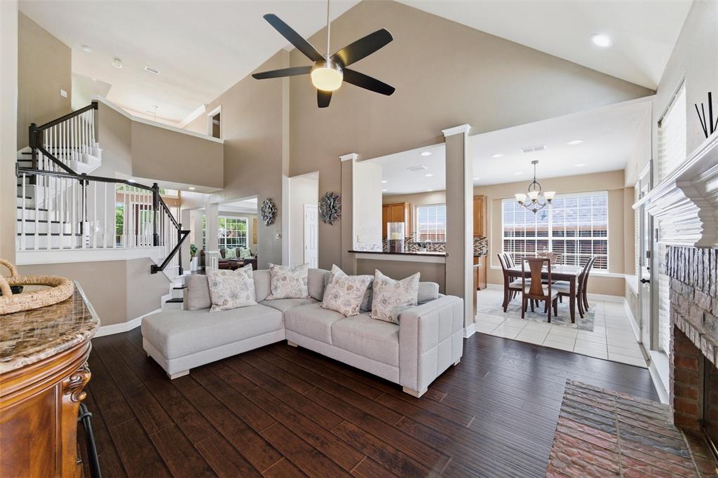 Family Rm has engineered wood, soaring ceiling, brick fireplace with gas start, elegant wood stairs, open to kitchen. Family Rm has engineered wood, soaring ceiling, brick fireplace with gas start, elegant wood stairs, open to kitchen.
