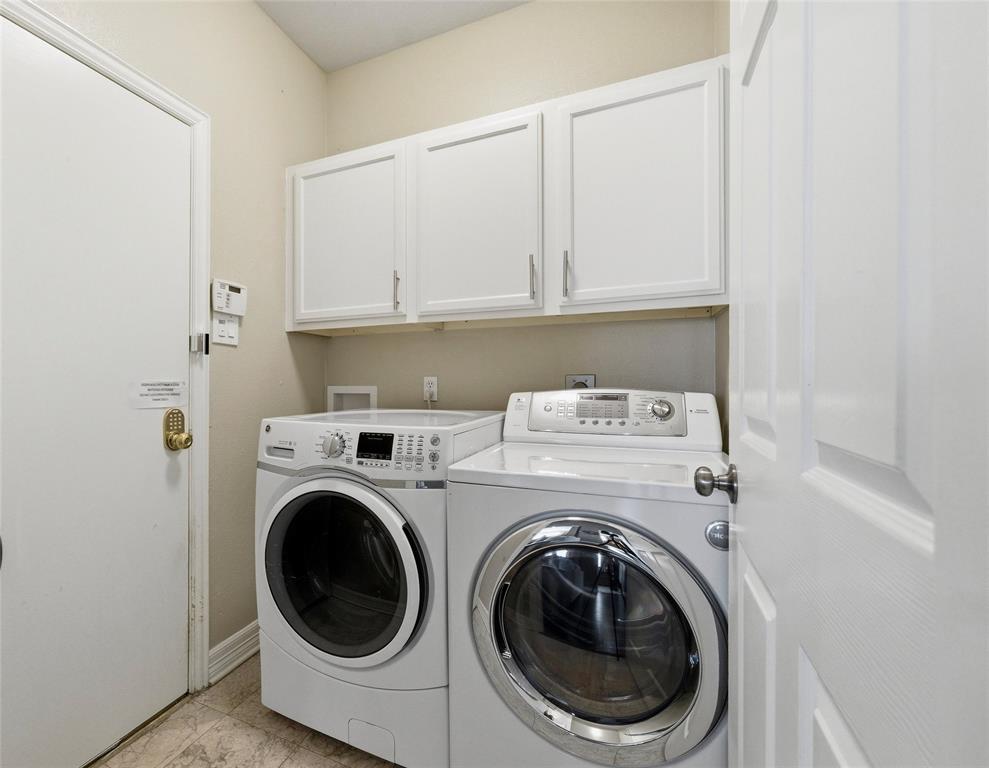 Utility Room has built in cabinets, door to garage to the left