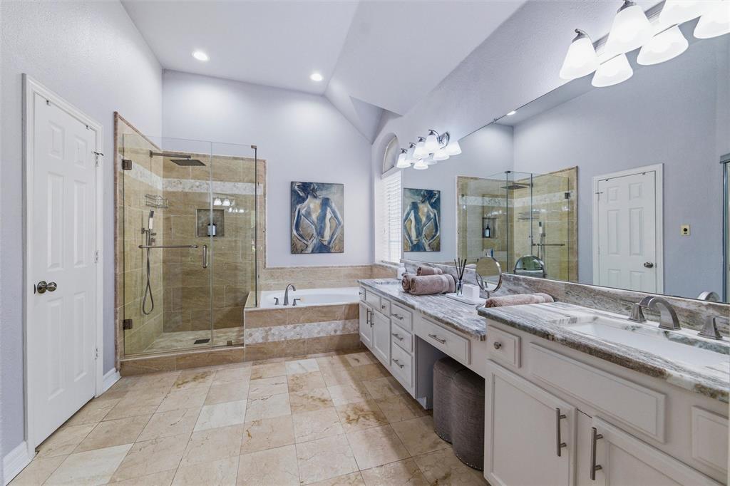 Updated ensuite bath features marble floors, shower surround, and counters, seamless glass, and bidet. Dual vanities, jetted tub, and all updated fixtures including rain head with handheld shower faucets.