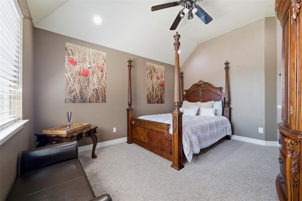Bedroom 4 with vaulted ceiling, large closet, ceiling fan, and and recessed lighting.