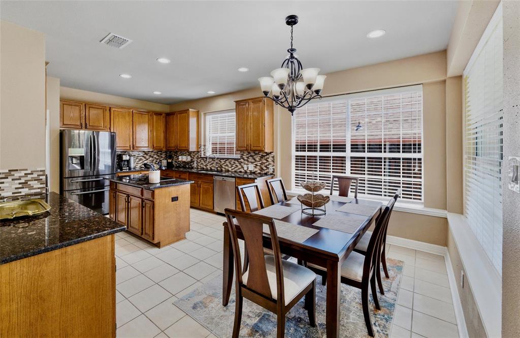 Large eat in kitchen with granite counters and quality glass mosaic backsplash. Lots of storage with 42in cabinets. Large eat in kitchen with granite counters and quality glass mosaic backsplash. Lots of storage with 42in cabinets.