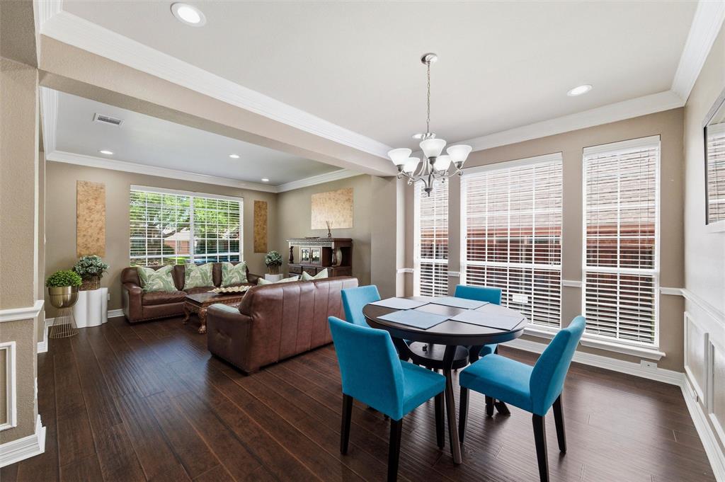 Light filled Dining Rm with chair rail and crown molding. Light filled Dining Rm with chair rail and crown molding.