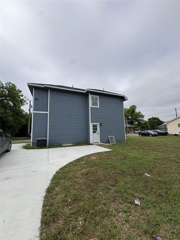 Two-story exterior with blue horizontal siding and white trim