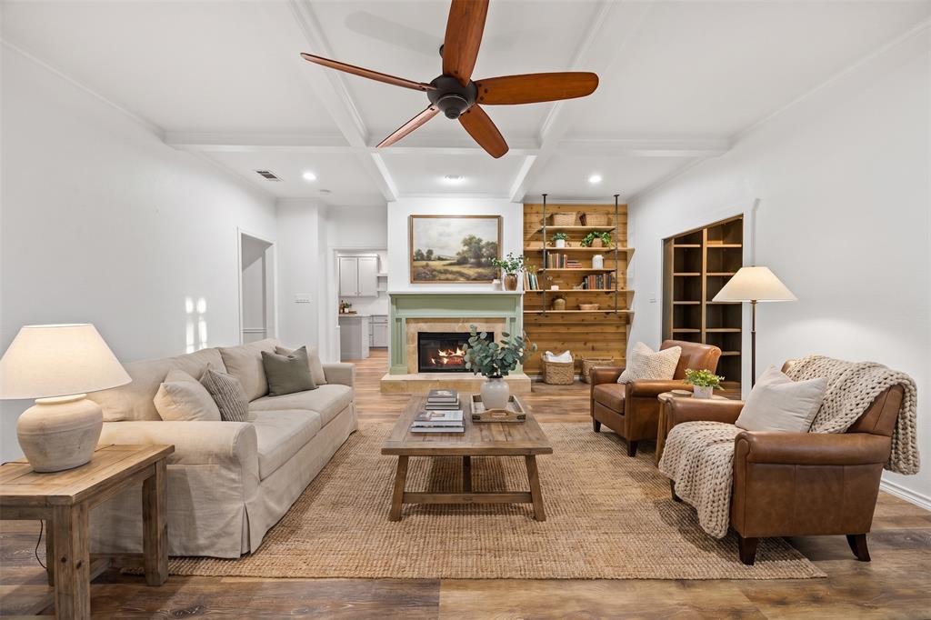 Living area featuring coffered ceilings and wood-finish flooring