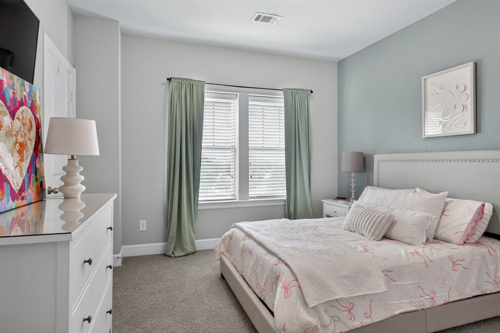 Spacious and bright fourth bedroom offering comfort, versatility, and plenty of natural light.