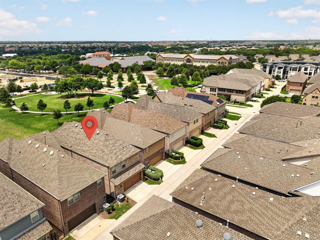 Aerial view showcasing the property along with its impressive surroundings and desirable setting.
