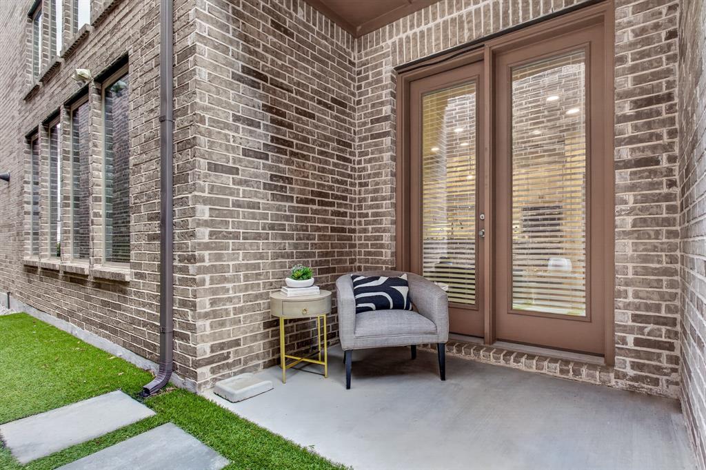 Private side patio featuring a low-maintenance turf area — perfect for relaxing, entertaining, or enjoying outdoor living year-round.