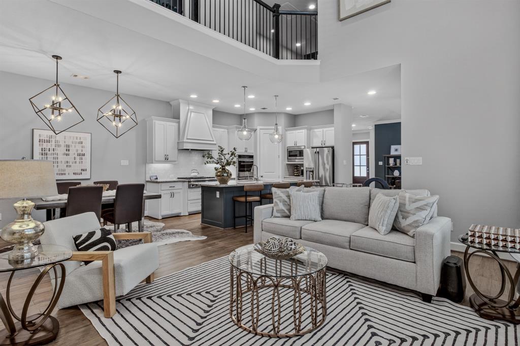 Grand open living space with high ceilings that fills the home with light and an inviting sense of openness.