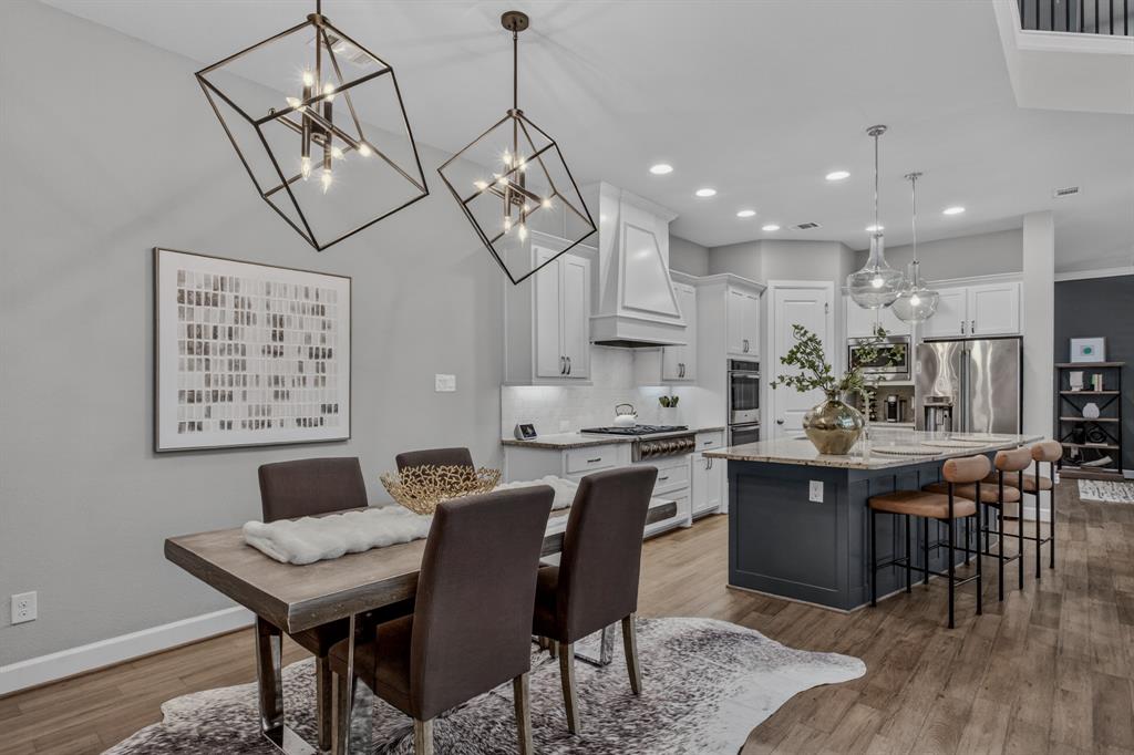 Modern light fixture adorn the dining room