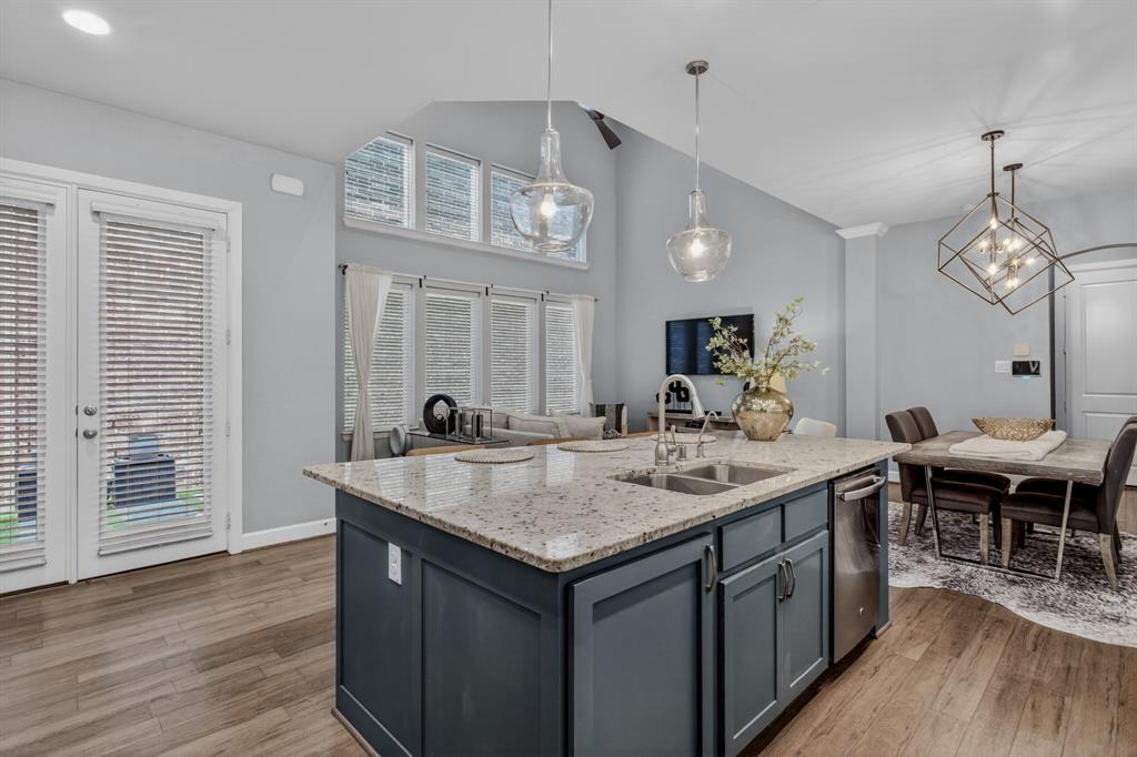 Open-concept kitchen overlooking living and dining areas