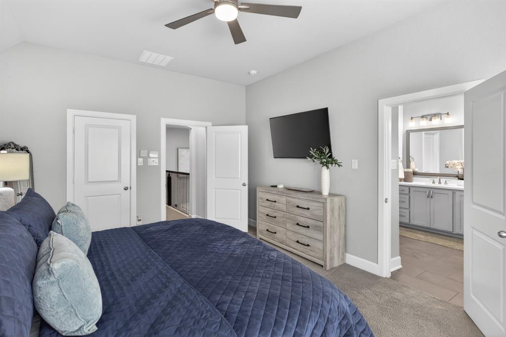 View of primary bedroom leading to primary bath.