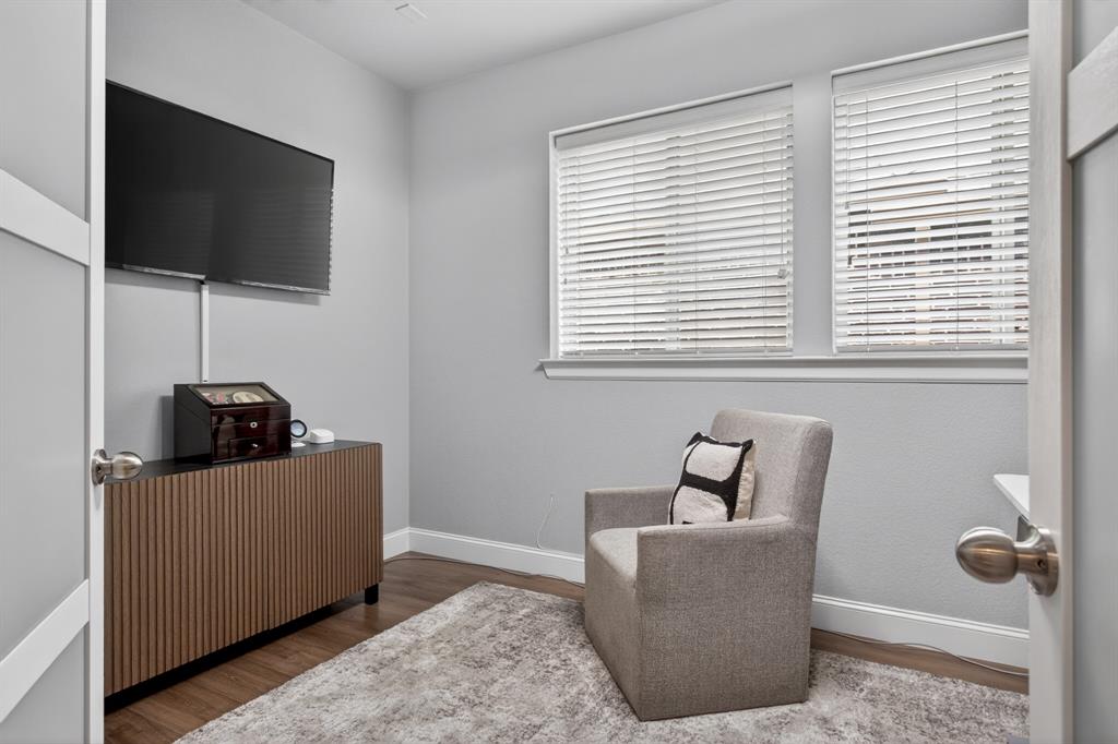 An enclosed flex space has been thoughtfully customized by the seller to create a second home office — ideal for remote work, studying, or a private creative space!