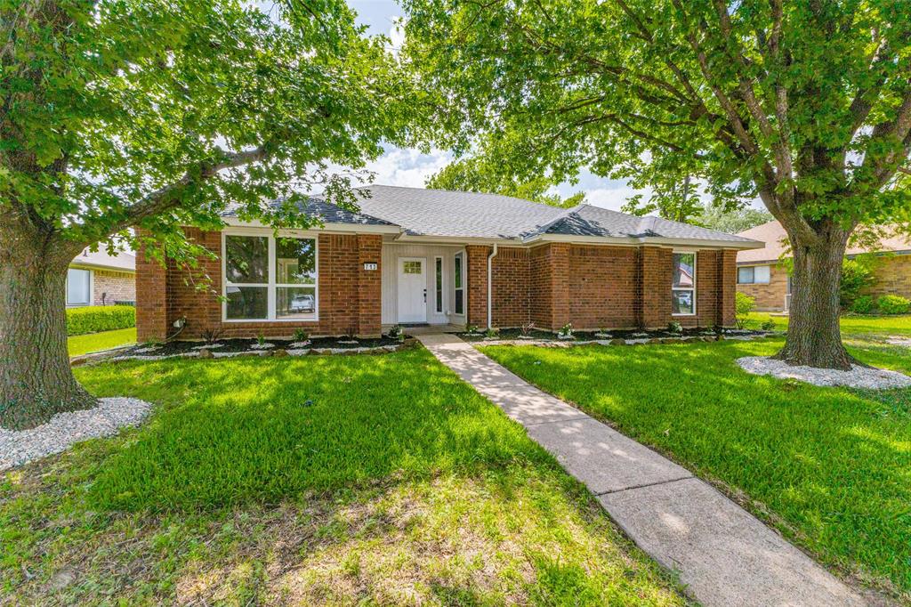 Traditional brick exterior with a white front door and surrounding sidelights Traditional brick exterior with a white front door and surrounding sidelights