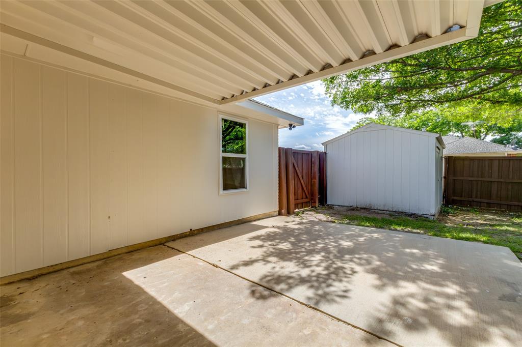 Covered concrete patio with white corrugated ceiling