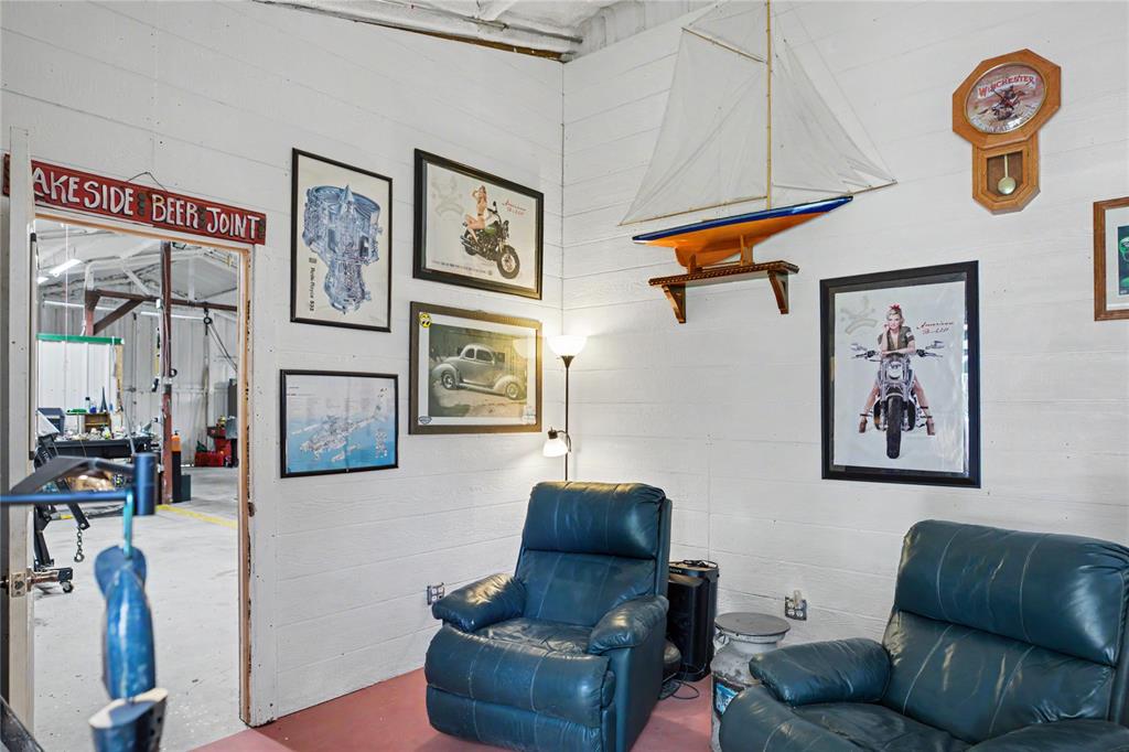 White paneled walls define this interior space, featuring a doorway to an adjacent area