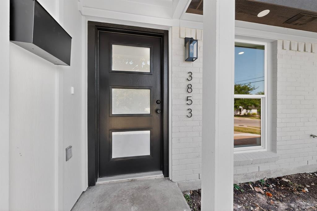 Black modern entry door with three frosted glass panels