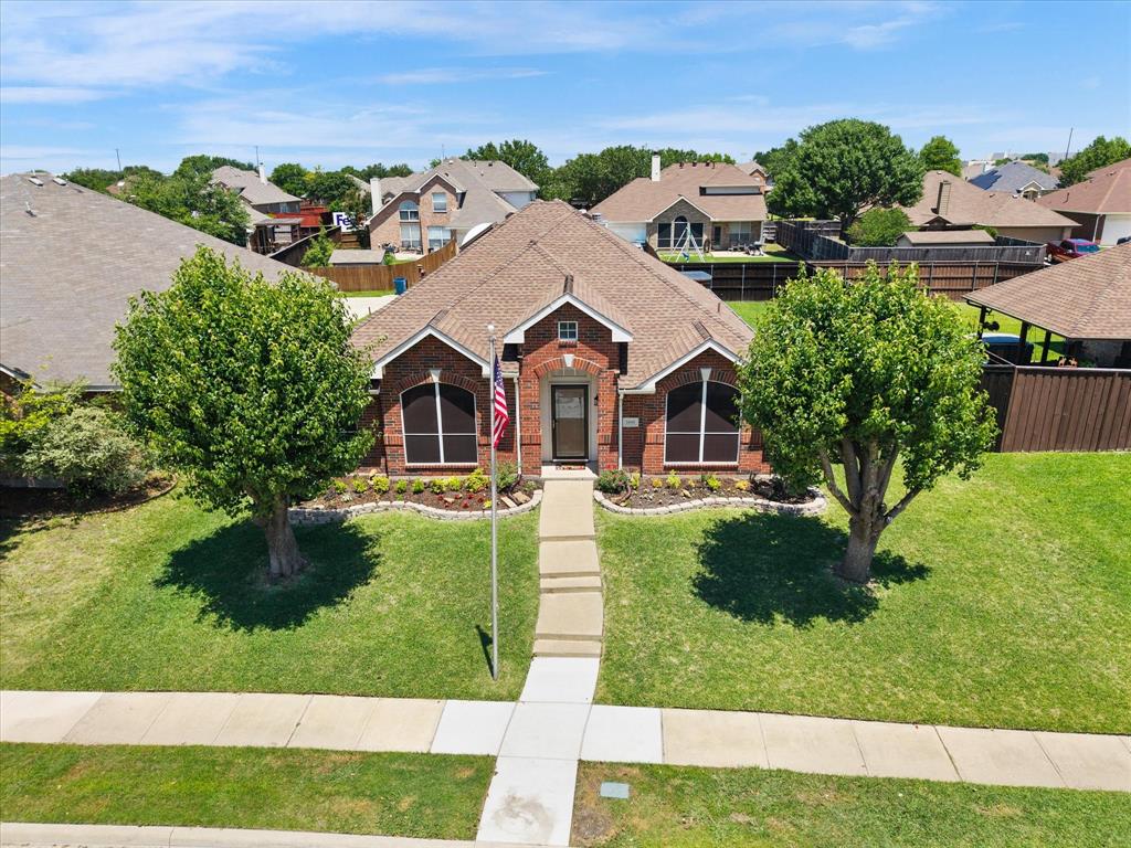 The home features a storm door and solar screens to help with energy efficiency.