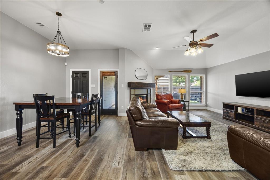 The family room's wall of windows overlooks the covered patio and backyard.