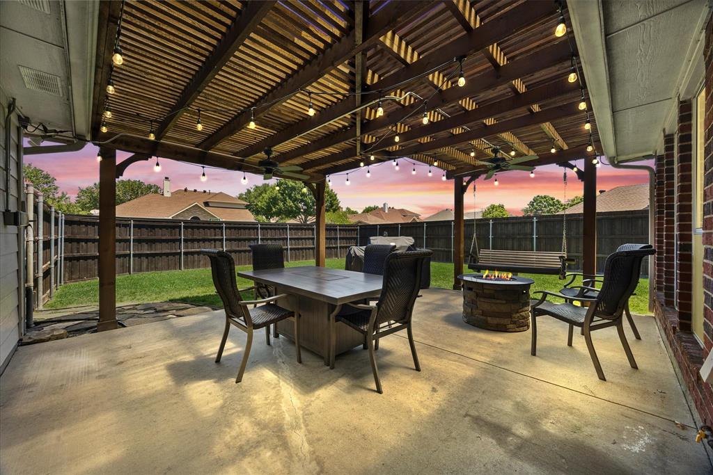 The backyard is ready for outdoor entertaining with its huge pergola covered patio with string lights, ceiling fan and gas stub for your grill.