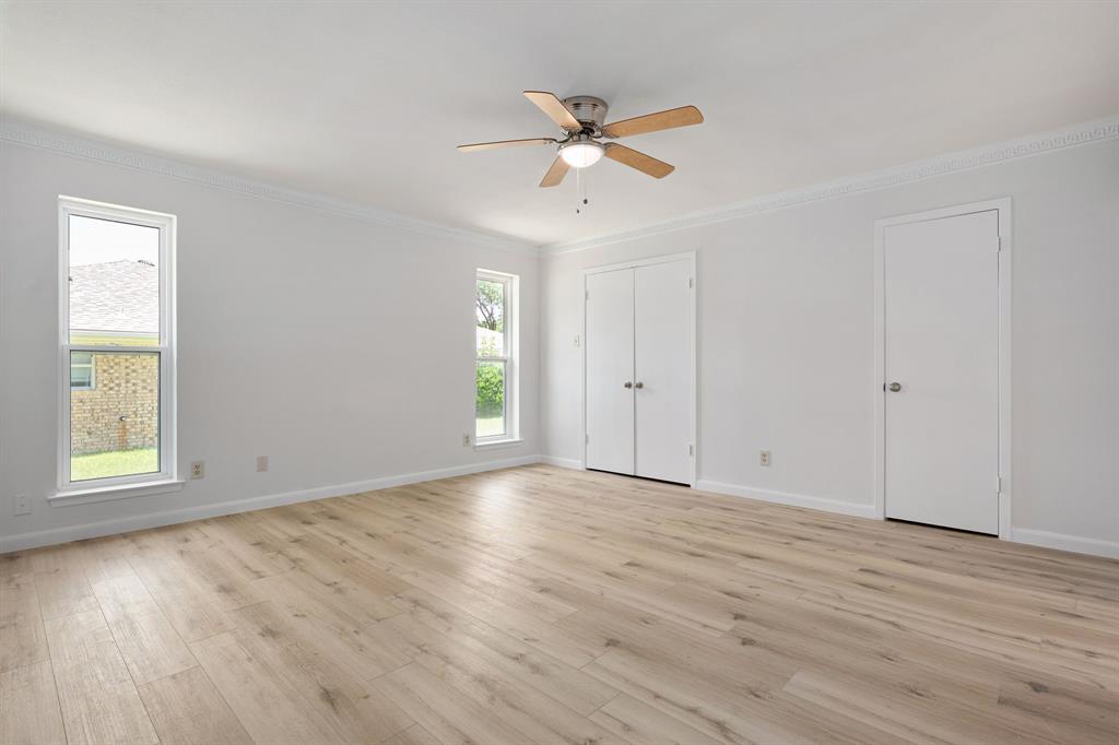 Light wood-finish flooring complements the bright interior