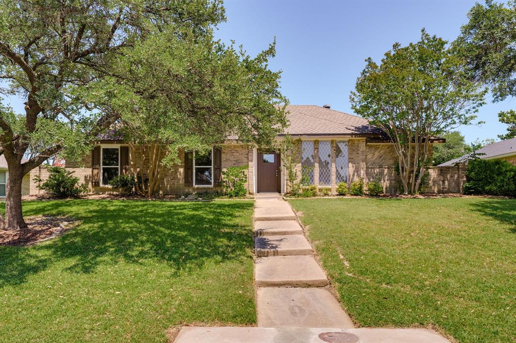 Brick exterior featuring a gabled roof and a stepped concrete walkway Brick exterior featuring a gabled roof and a stepped concrete walkway