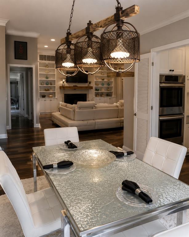 Light and bright dining with designer wood wall and view of private coffee patio