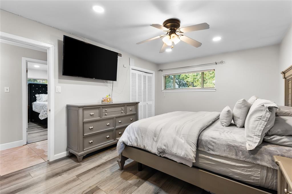 Bedroom featuring wood-finish flooring, recessed lighting, and a ceiling fan with light fixture