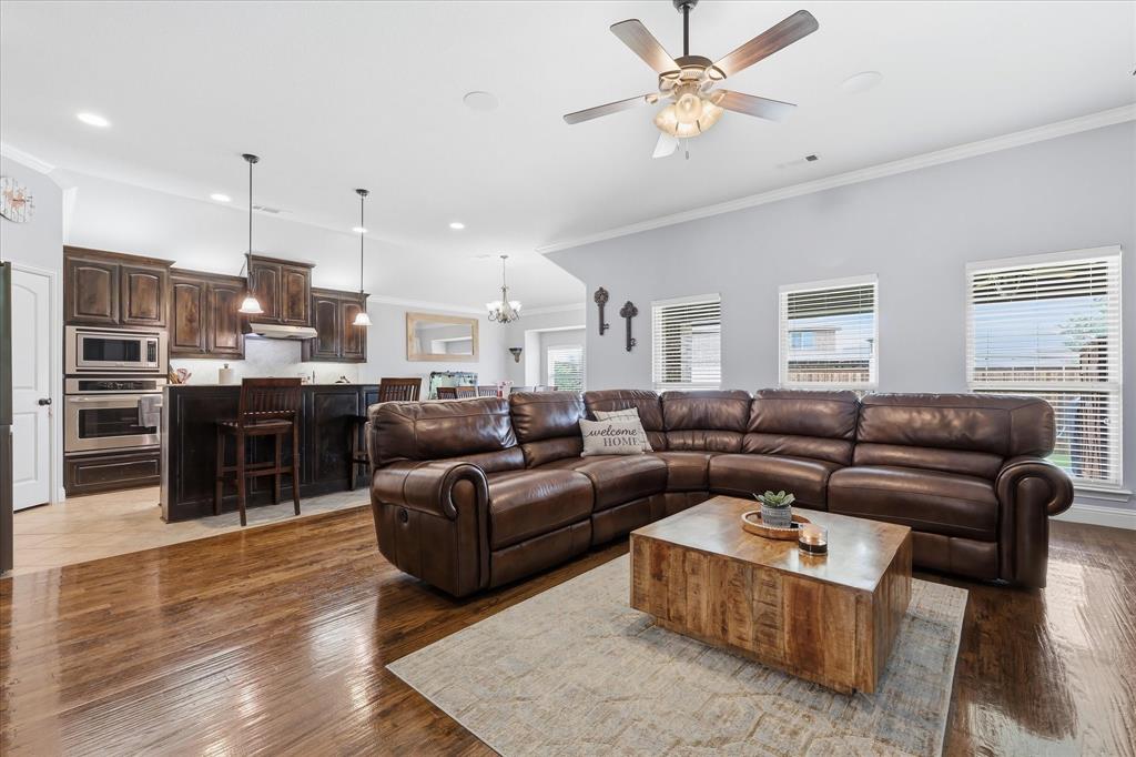 Open-concept living space featuring wood-finish flooring