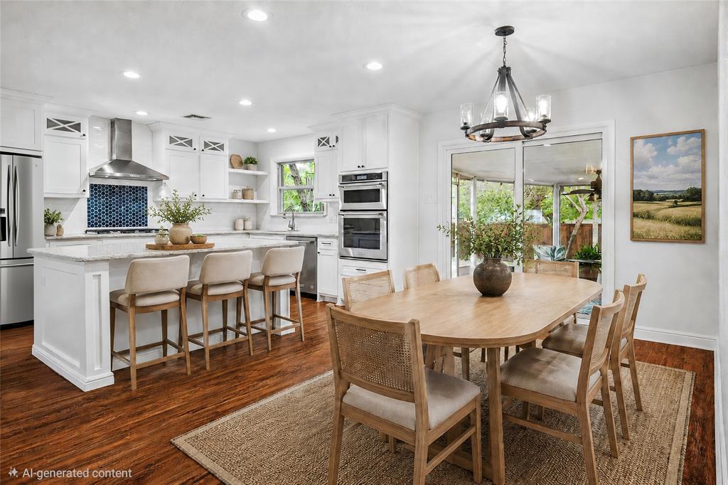 VIRTUAL STAGING: Spacious kitchen featuring an expansive island with seating, stainless steel appliances, white cabinetry, a blue mosaic tile backsplash, and wood-finish flooring