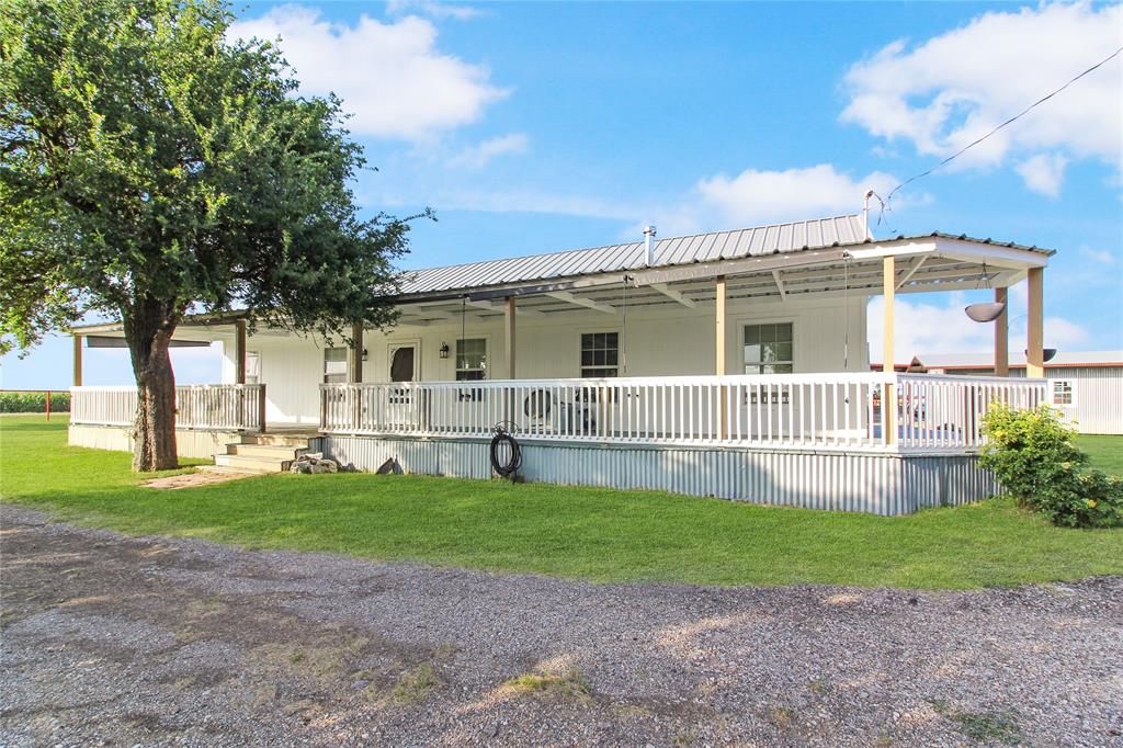 1936  HOUSE - White-sided exterior with a metal roof and an expansive lawn
