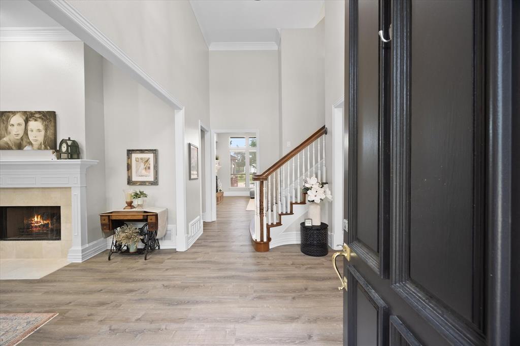 Towering ceilings and impressive staircase welcome your arrival