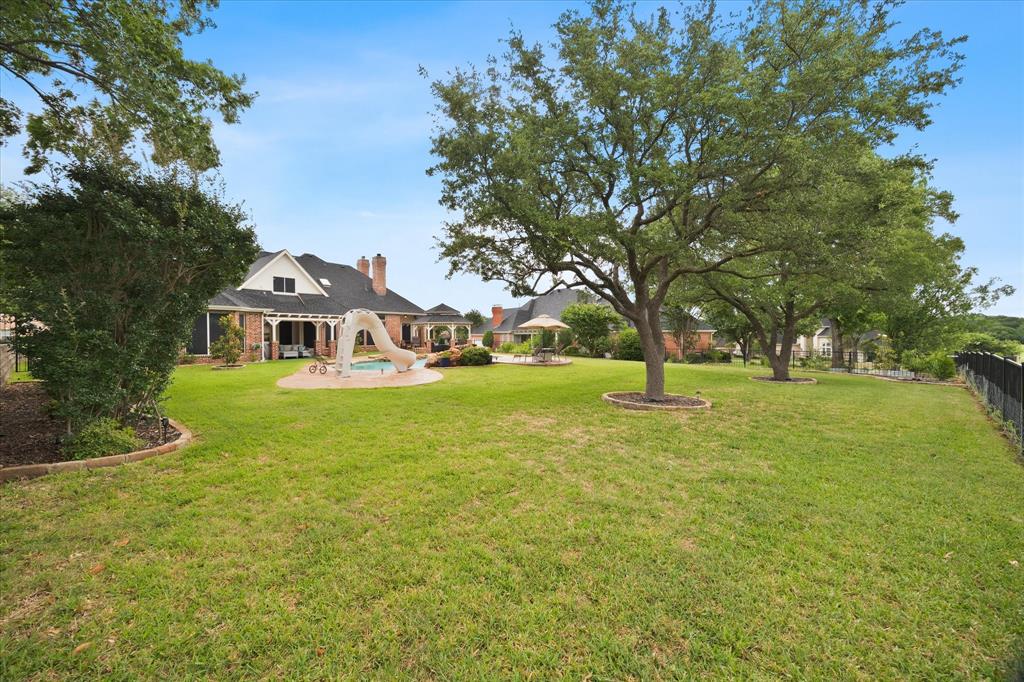 Expansive fenced backyard provides plenty of space to run and play!