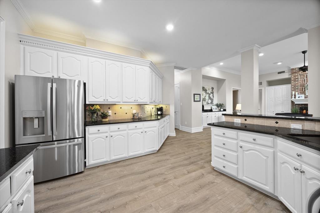 An abundance of custom cabinetry and countertops is a plus!