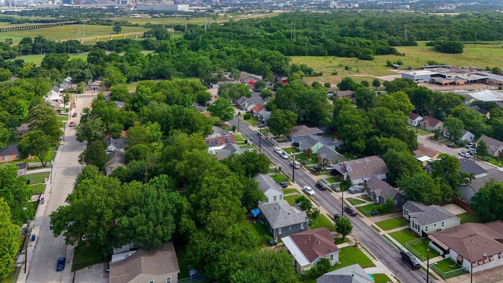 Aerial perspective showcasing a residential neighborhood with tree-lined streets