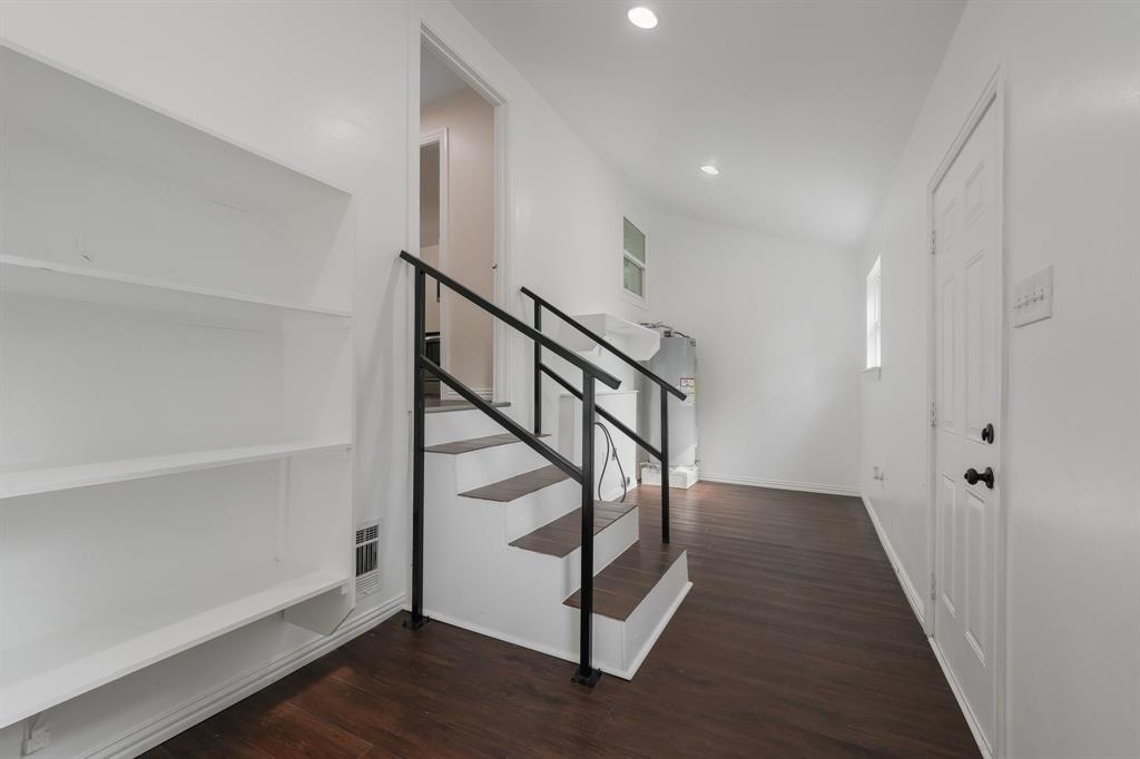 Pantry area, washer and dryer connection and water heater.