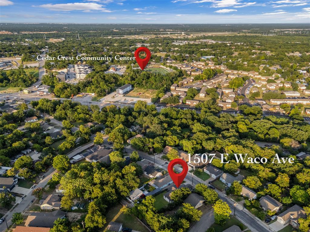 Aerial view of a residential neighborhood with dense tree coverage