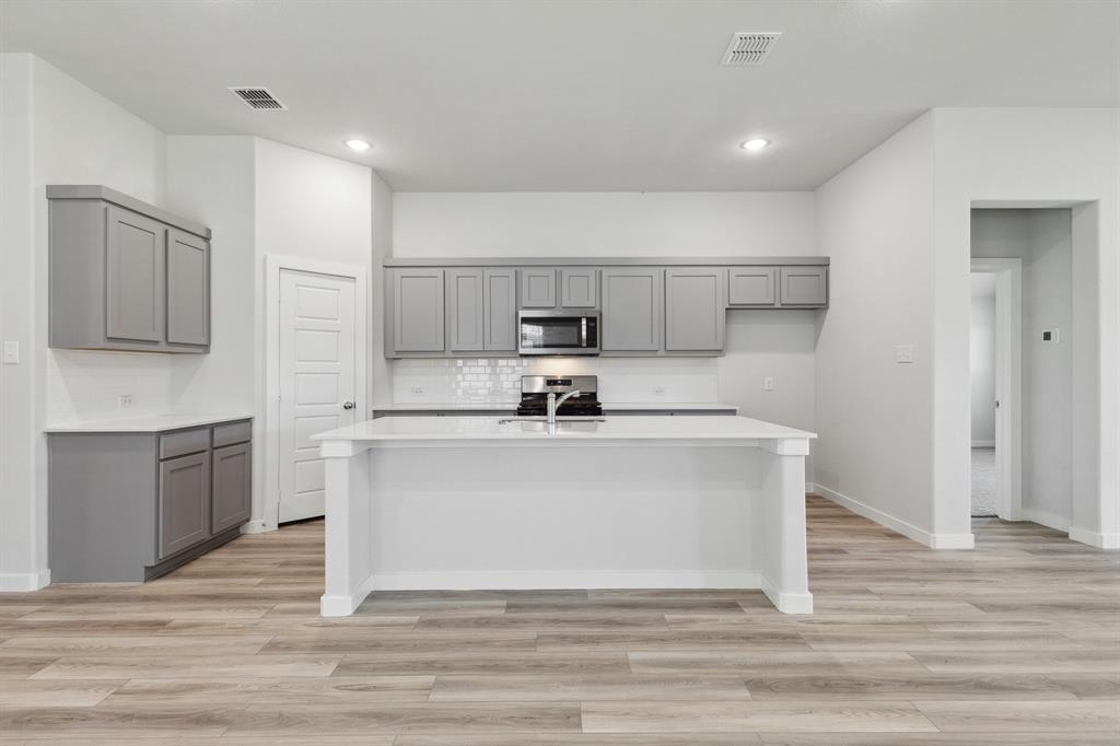 Kitchen in the Quartz home plan by Trophy Signature Homes – REPRESENTATIVE PHOTO Kitchen in the Quartz home plan by Trophy Signature Homes – REPRESENTATIVE PHOTO
