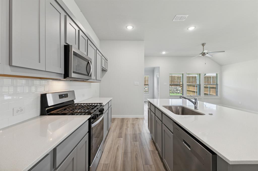 Kitchen in the Quartz home plan by Trophy Signature Homes – REPRESENTATIVE PHOTO Kitchen in the Quartz home plan by Trophy Signature Homes – REPRESENTATIVE PHOTO
