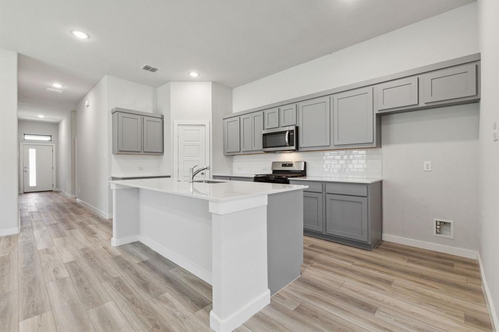 Kitchen in the Quartz home plan by Trophy Signature Homes – REPRESENTATIVE PHOTO Kitchen in the Quartz home plan by Trophy Signature Homes – REPRESENTATIVE PHOTO