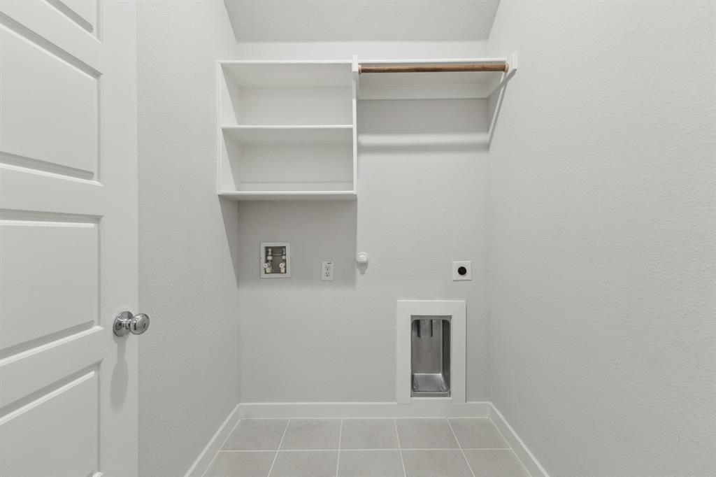 Utility room in the Quartz home plan by Trophy Signature Homes – REPRESENTATIVE PHOTO
