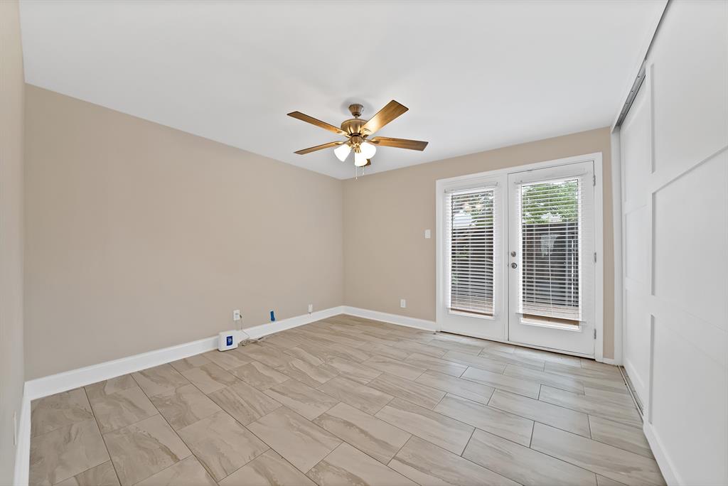 Bedroom 2 with doors to back deck