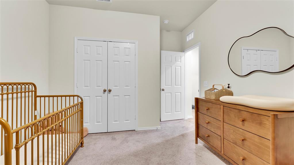Carpeted room with light-colored walls