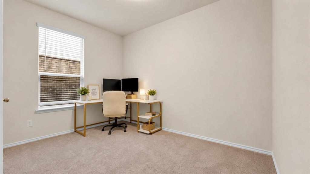 Carpeted room with closet, featuring light neutral wall paint, a single window with blinds, and white trim