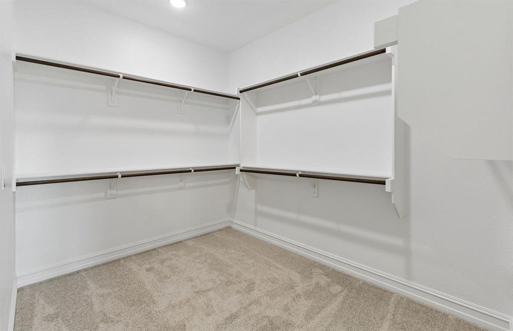 Spacious walk-in closet in owners suite