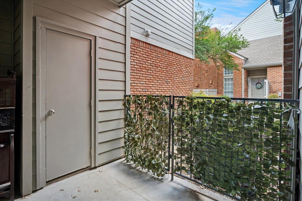 Outdoor patio with a storage closet.