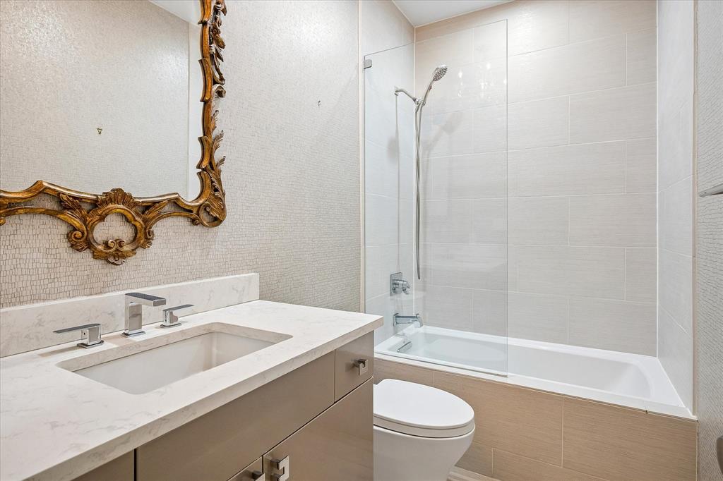 Guest bathroom remodeled including acrylic cabinets.
