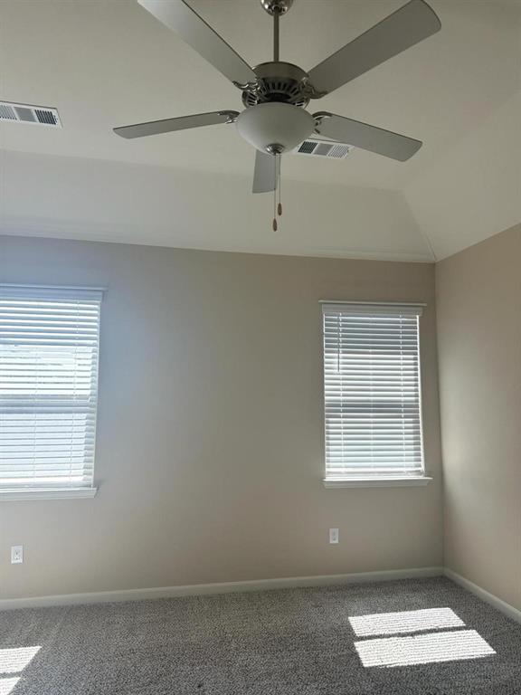 Tray ceiling featuring a brushed nickel ceiling fan with integrated lighting